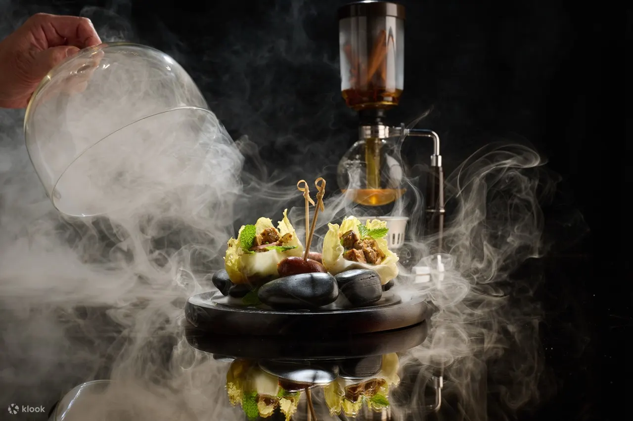 Duck Palo Consomme Served with Duck Larp