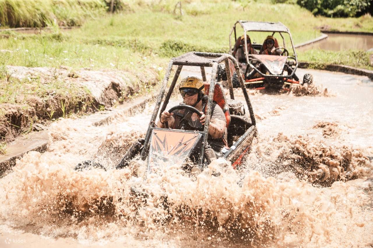 Powered through muddy terrain with friends trailing close behind