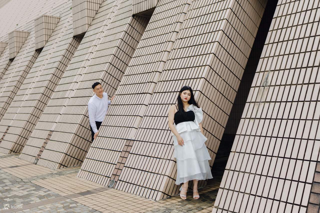 Capture your love story against the backdrop of the iconic Cultural Centre building in Tsim Sha Tsui, where stunning architecture meets the vibrant energy of Hong Kong's cultural scene.