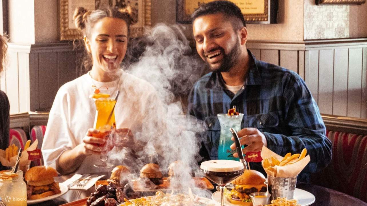 Indulging in delicious food at Hard Rock Cafe, surrounded by friends and great vibes