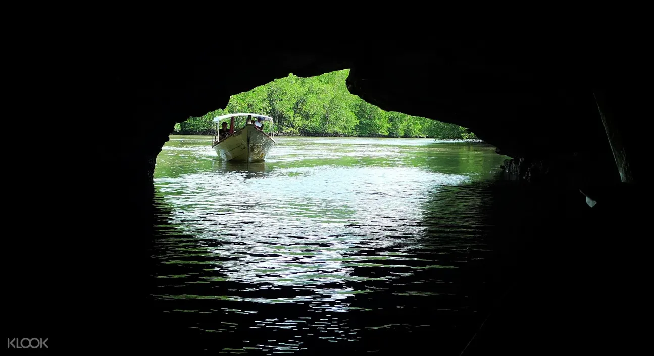 boat entering a cave in langkawi