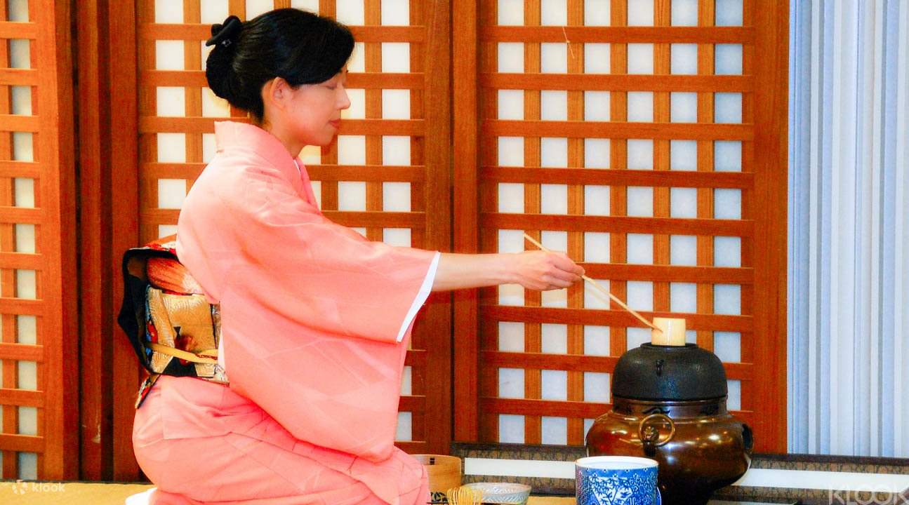 Japanese tea host during tea ceremony