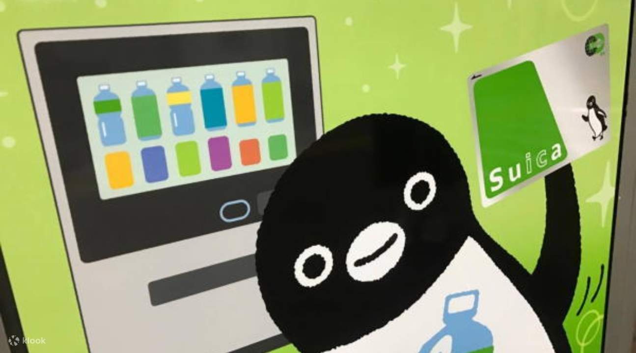 a vending machine with the Suica penguin holding a Suica IC Card