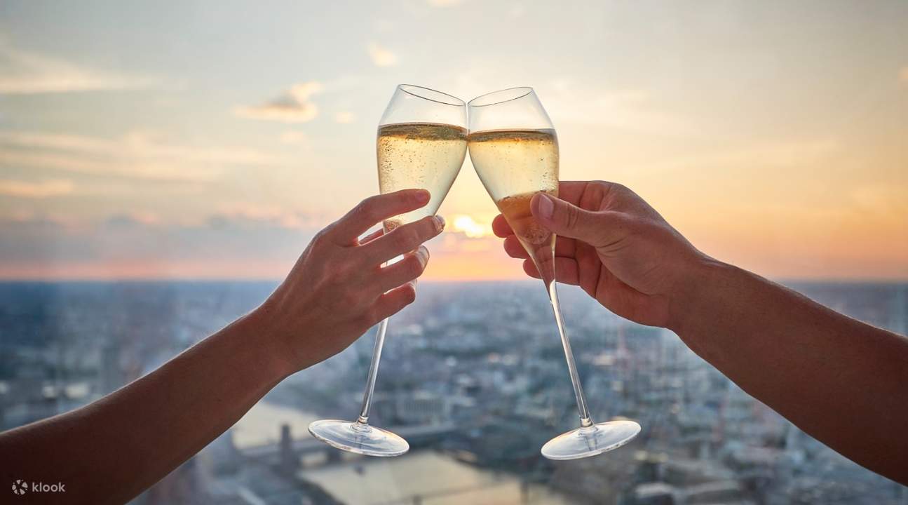 champagne glasses toasting in view from the shard