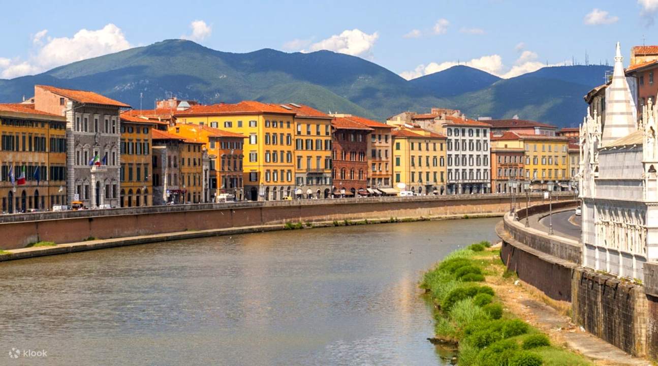 river and houses in pisa
