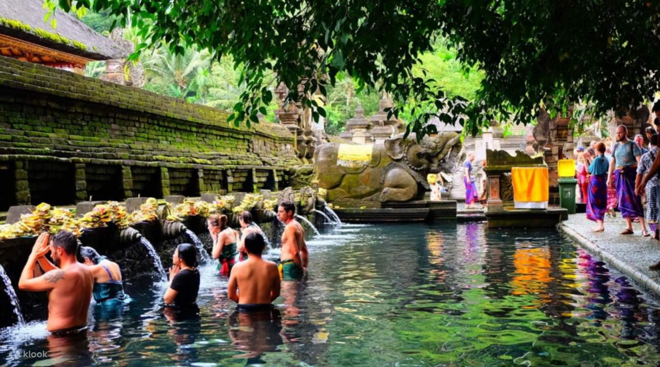 people bathing in tirta empul water temple