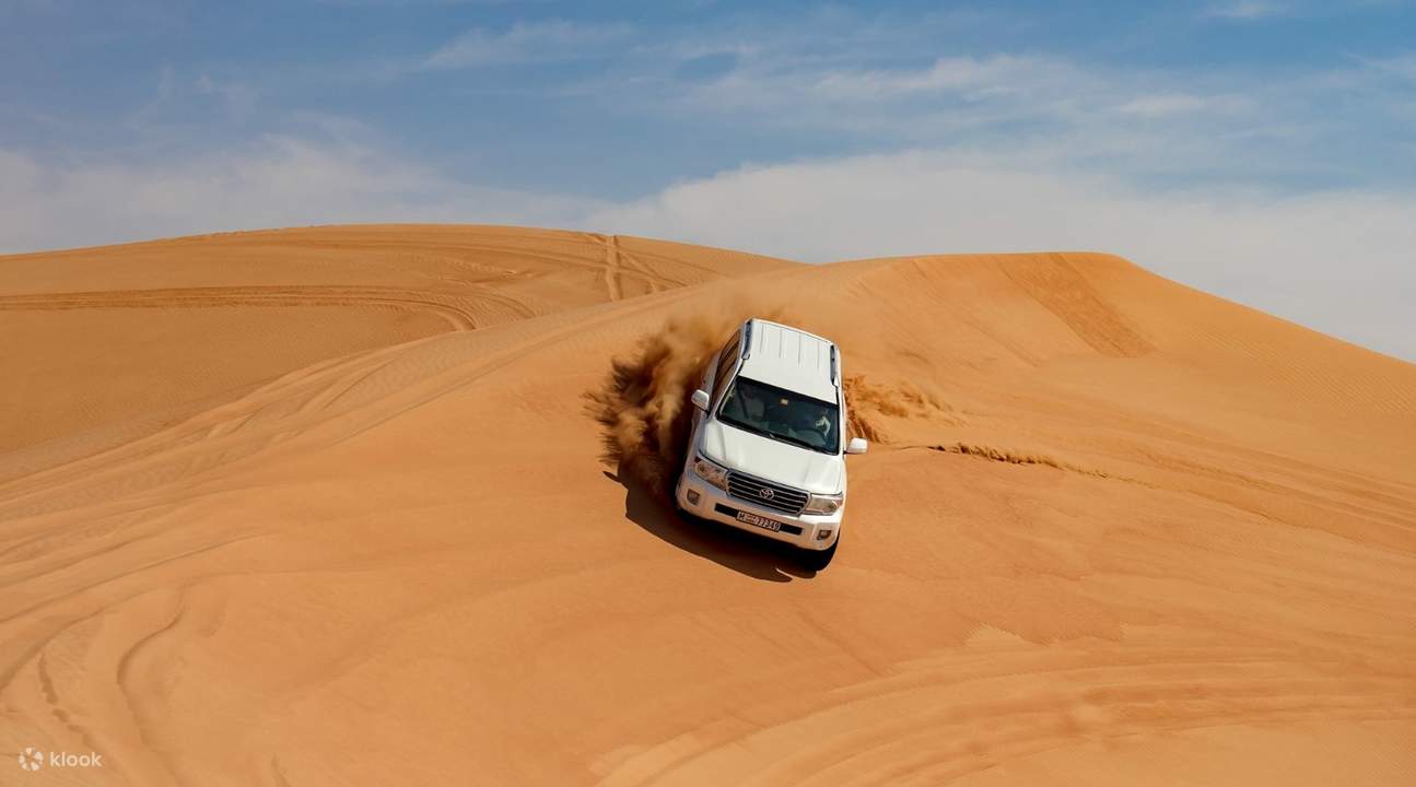 white car dune bashing during Dubai 2 day tour