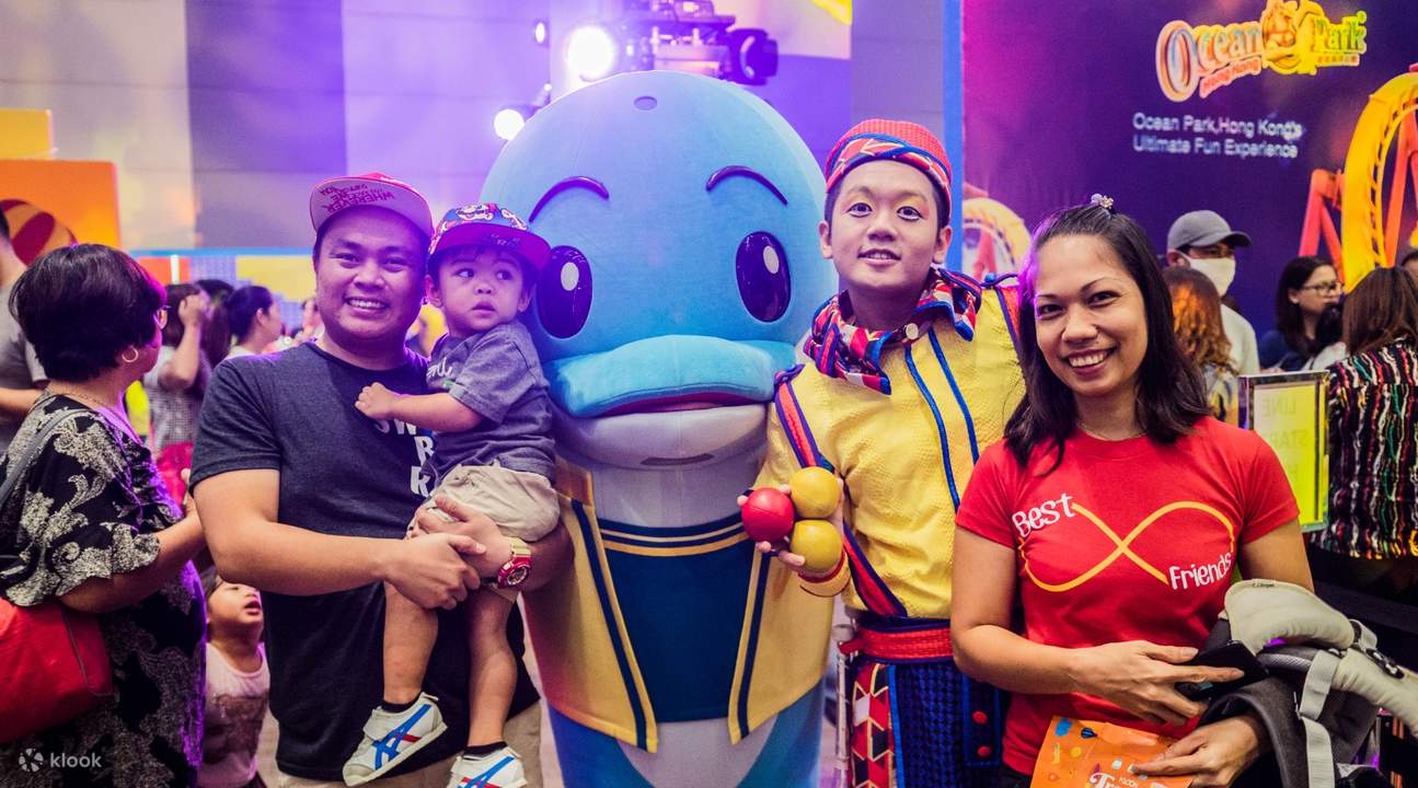 dolphin mascot with customers during klook travel fest 