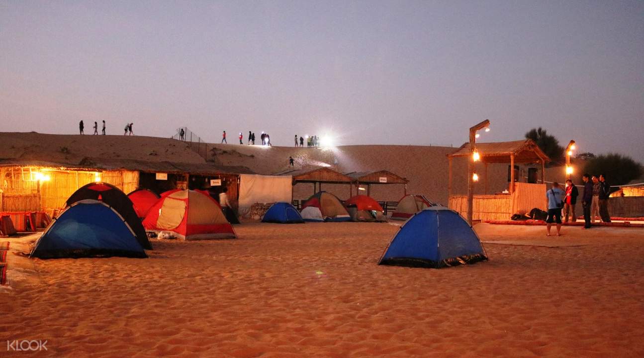 blue and red tents in desert camp