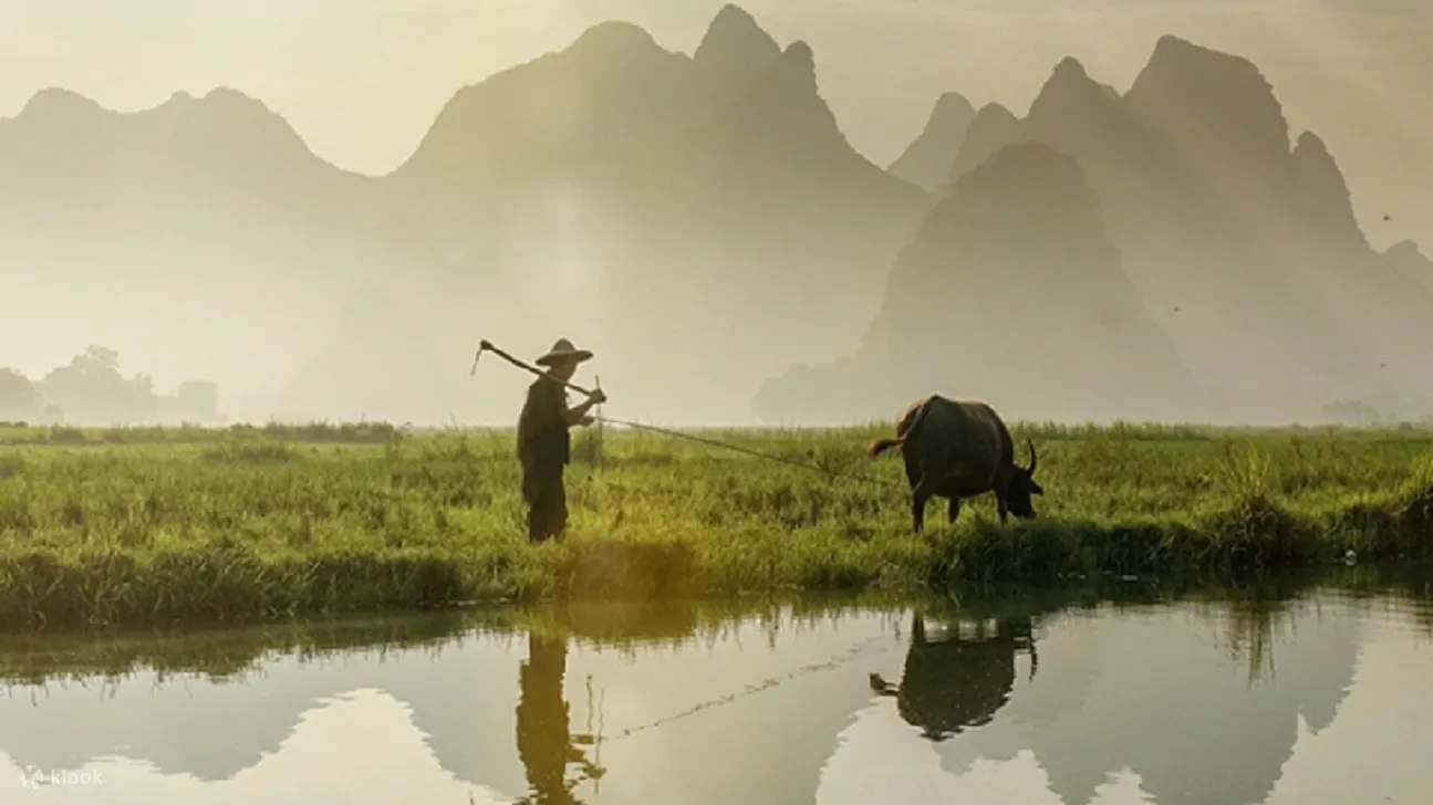 chinese farmer on the plains in yangshuo
