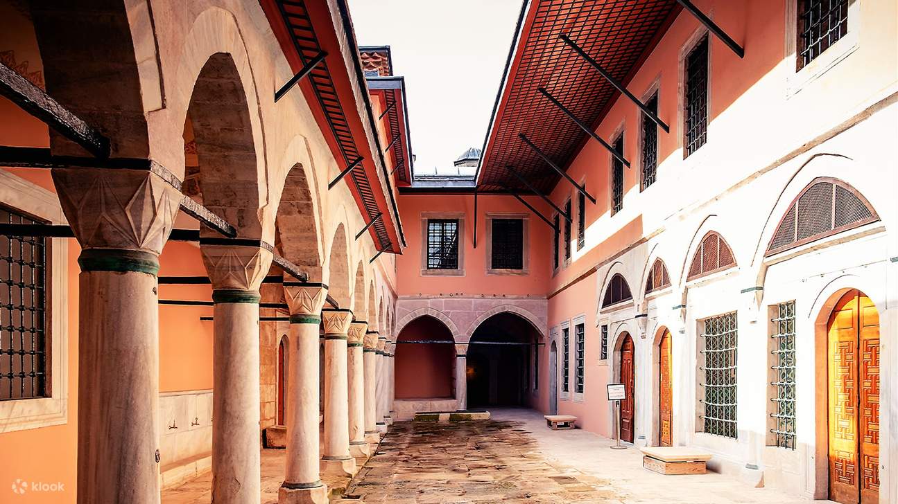 Picture yourself among dignitaries walking under towering arches and painted ceilings