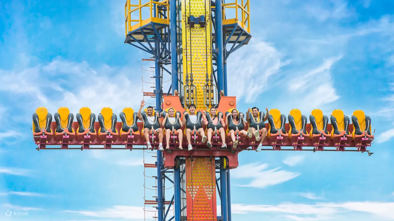 Indulge in sunshine-filled fun at a theme park that seamlessly blends exhilarating rides with refreshing water adventures.