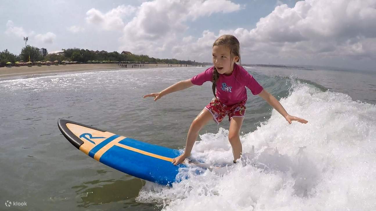 a young girl surfing
