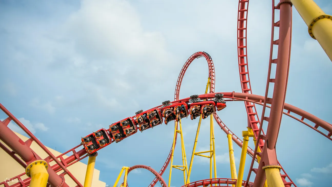 Brace yourself for a thrilling ride and conquer the powerful waves when surfing the incredible Zeus Firestorm roller coaster.