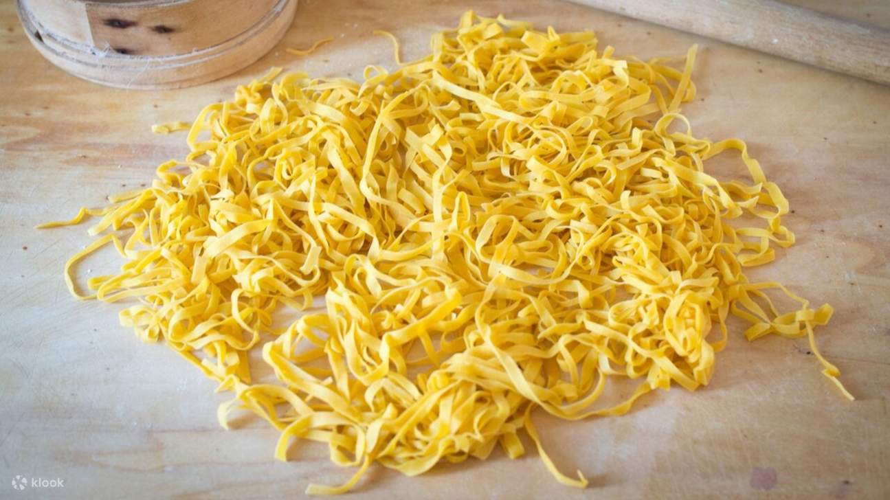 Freshly made tagliatelle: Golden strands of homemade pasta, ready for a delicious Italian meal