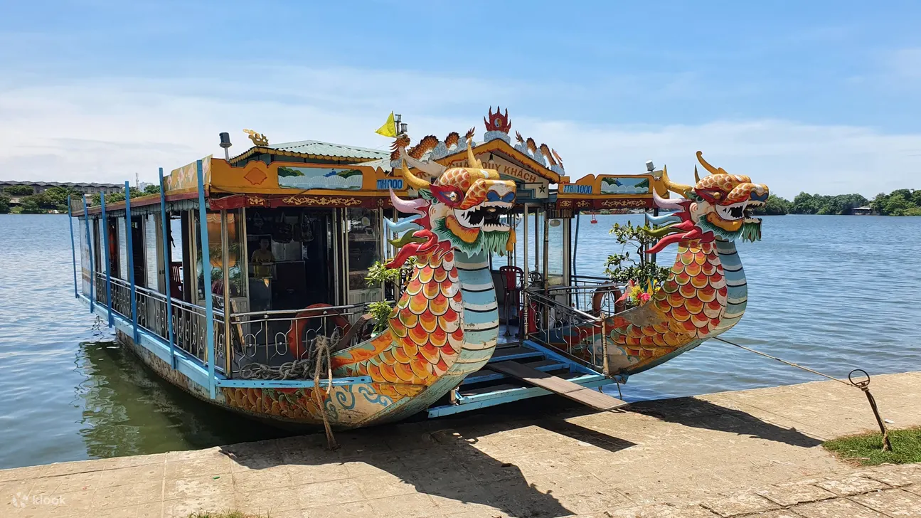 Two boats docked during traditional Hue music show on Huong River