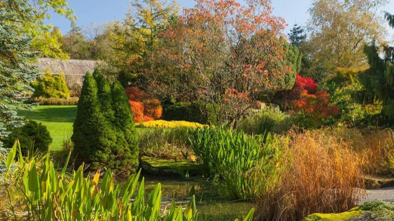 Wander through colorful borders bursting with seasonal blooms and charm