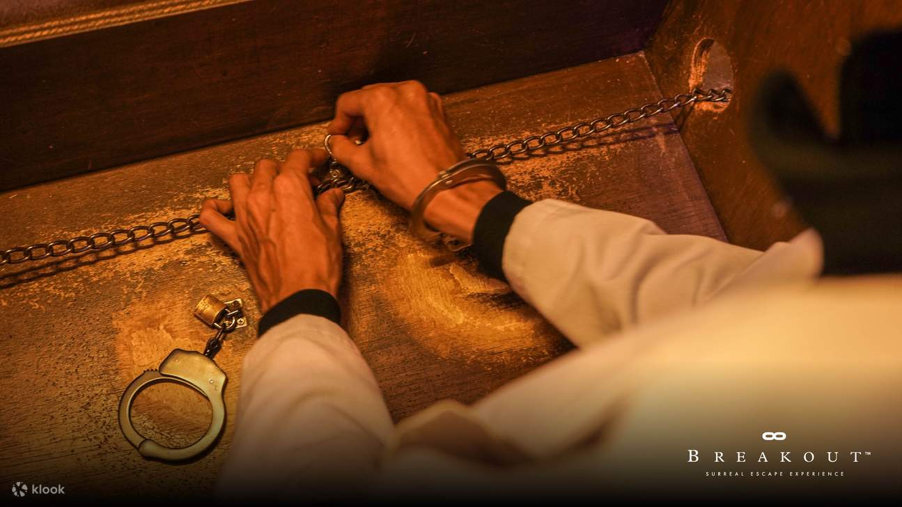 two persons solving a puzzle inside breakout kuala lumpur