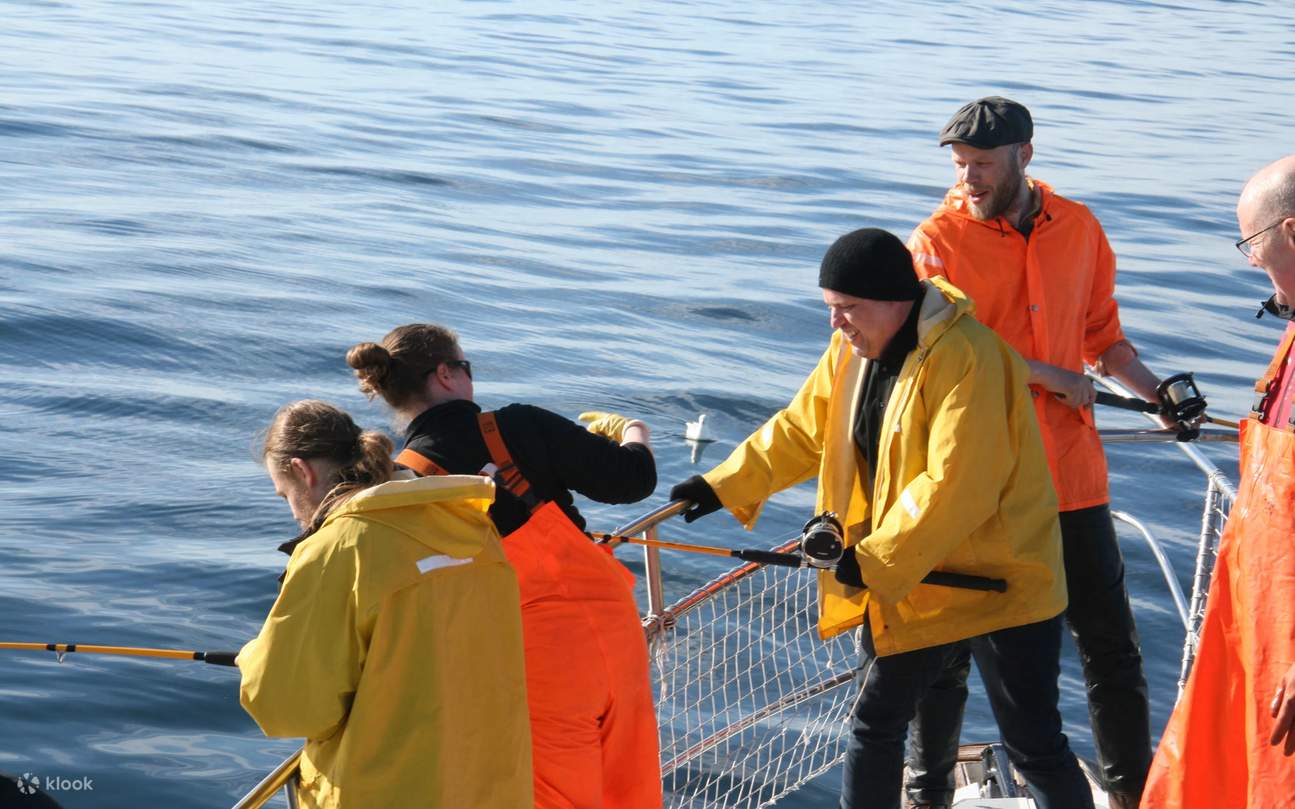 A local fisherman demonstrates techniques, guiding a guest’s hands with practiced patience
