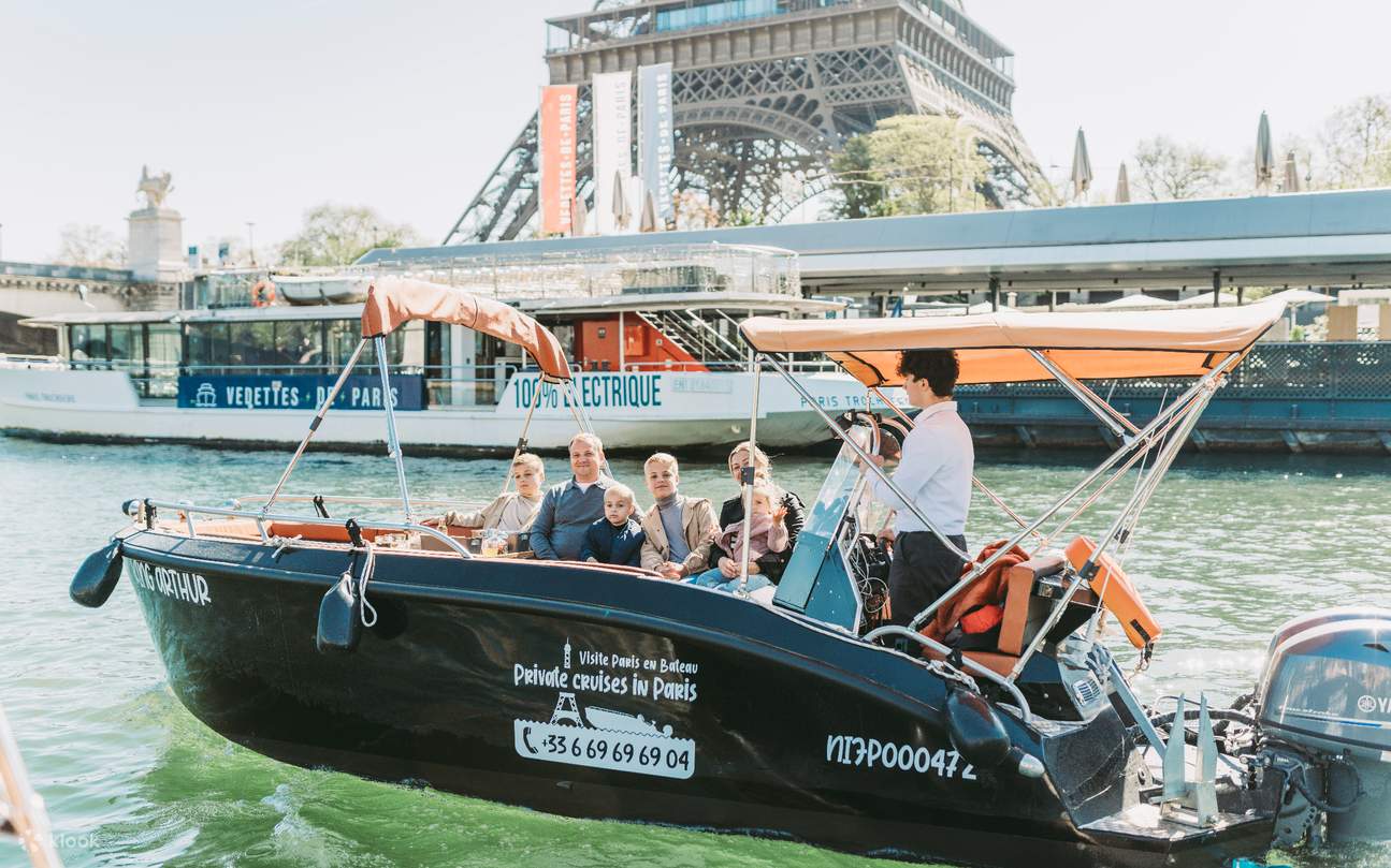 A family relaxes on a luxury boat cruise, enjoying the scenic and comfortable ride
