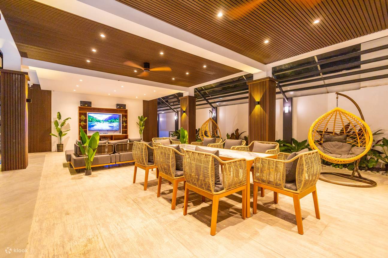 Dining area with a long table and television