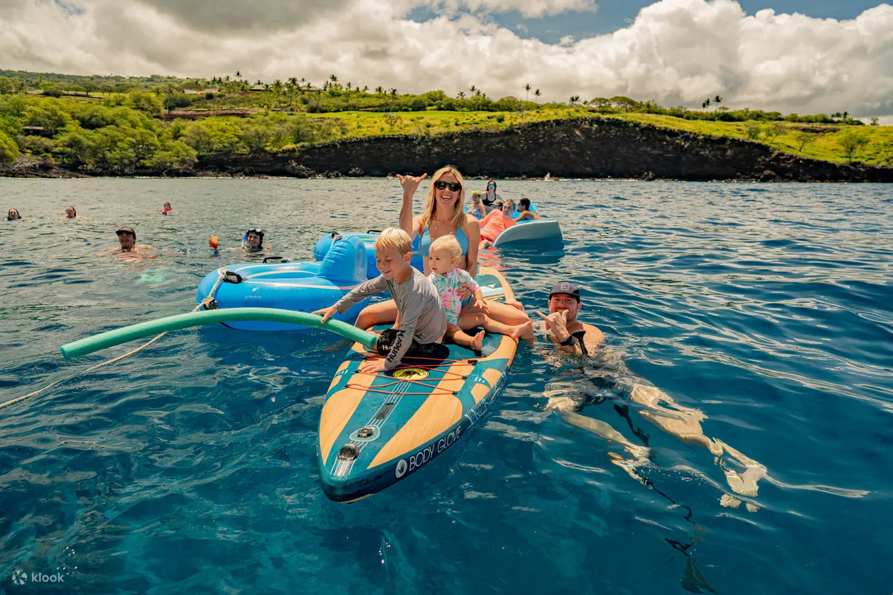 A family on a surf board