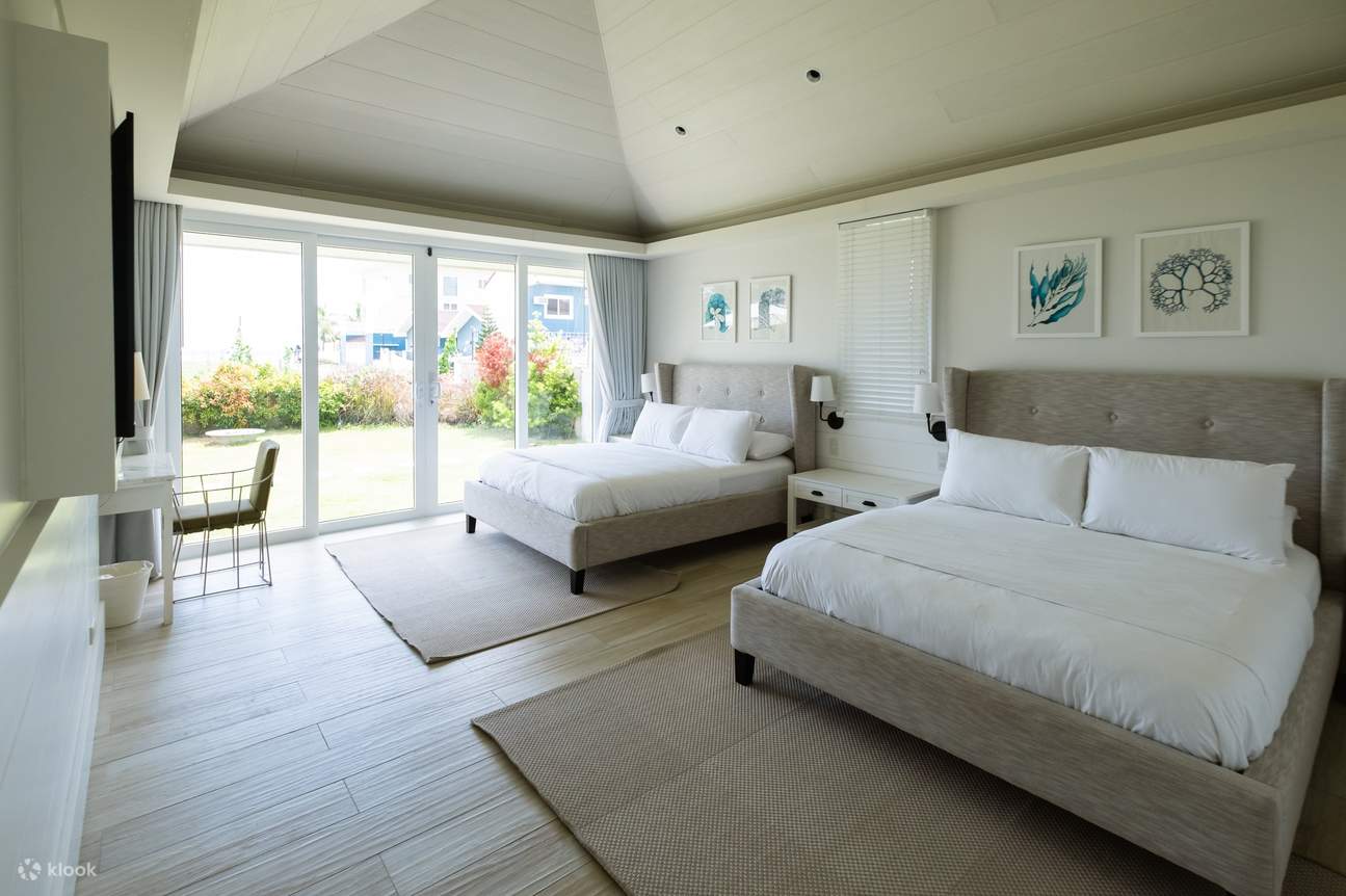 A cozy bedroom with two comfortable beds, perfect for a good night's sleep