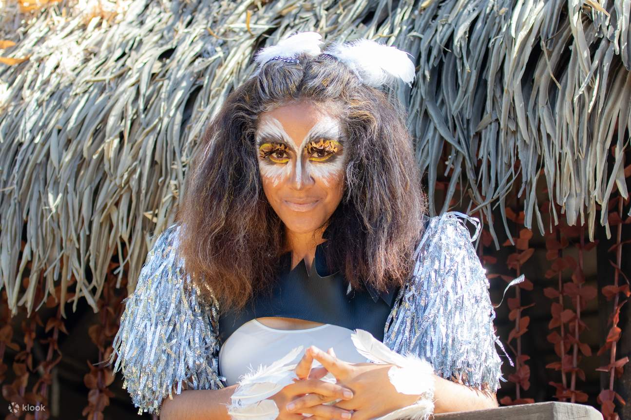 A female performer in traditional costume and makeup