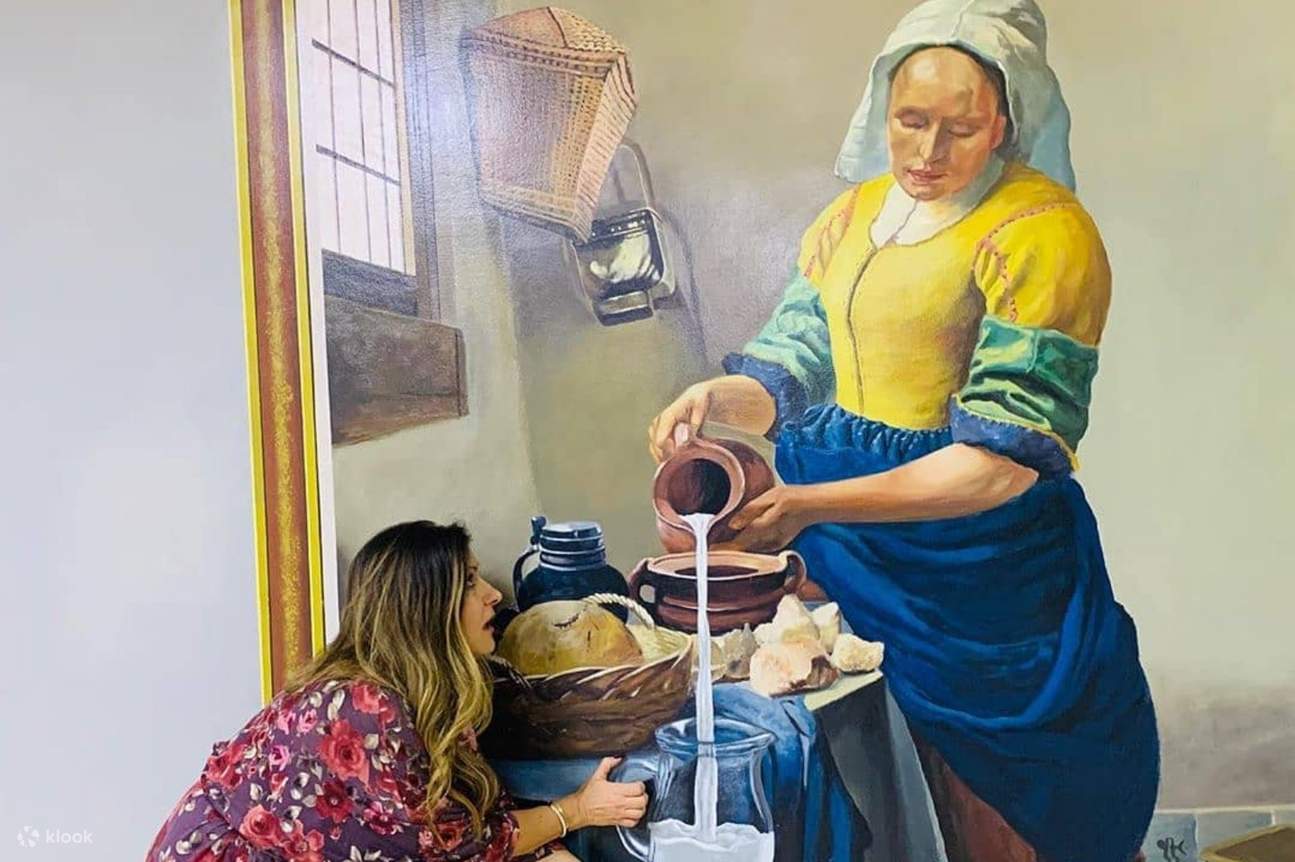 Woman catching milk in Dubai 3D Art Museum