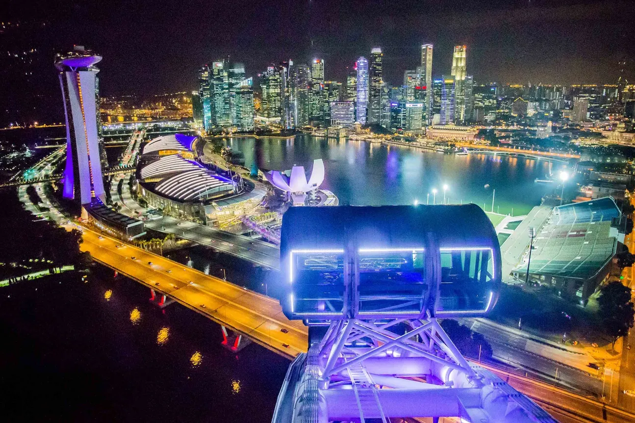 a view of Singapore at night from the Singapore Flyer