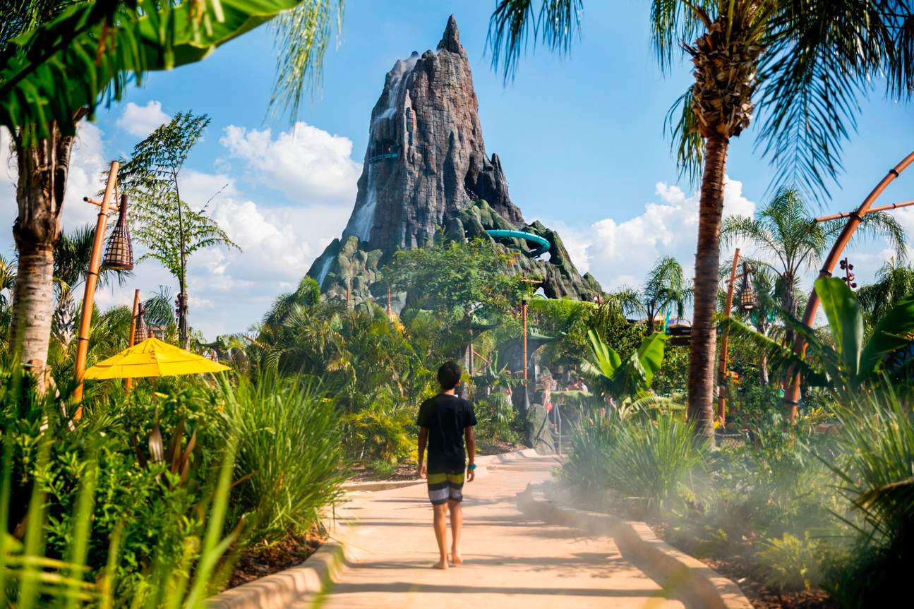 Person walking towards a mountain