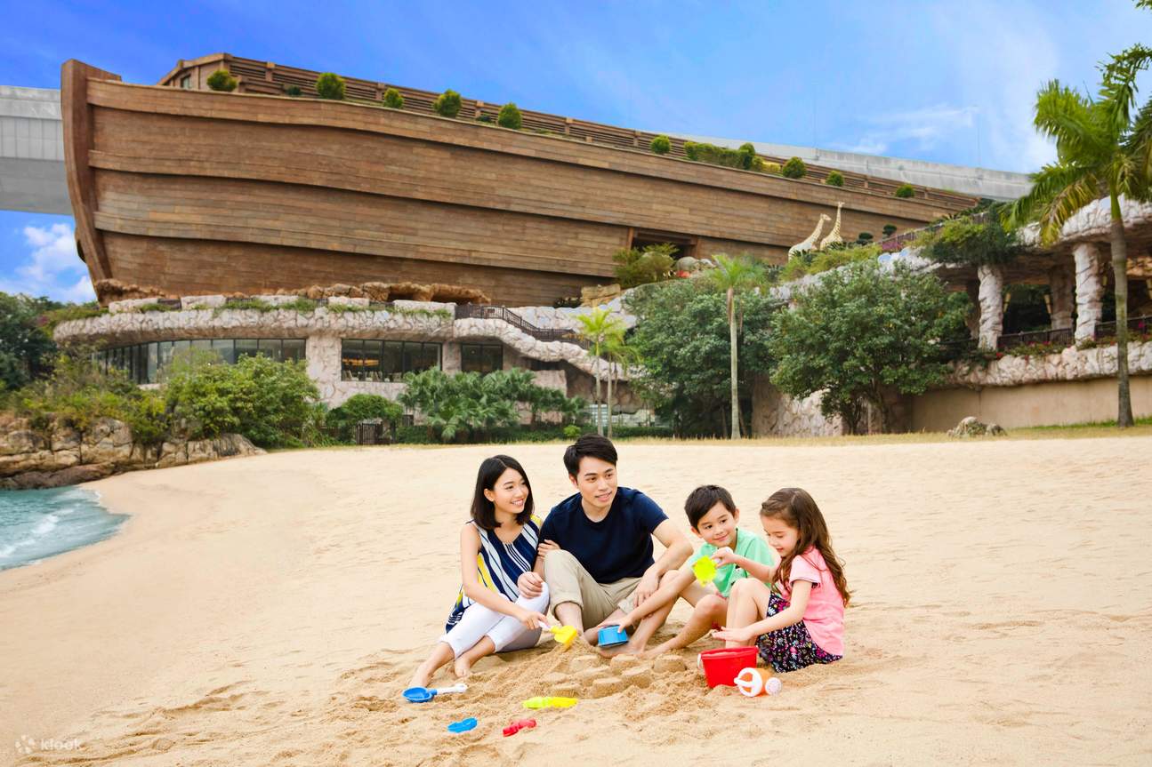 a family on beach area in Noah's Ark Hong Kong