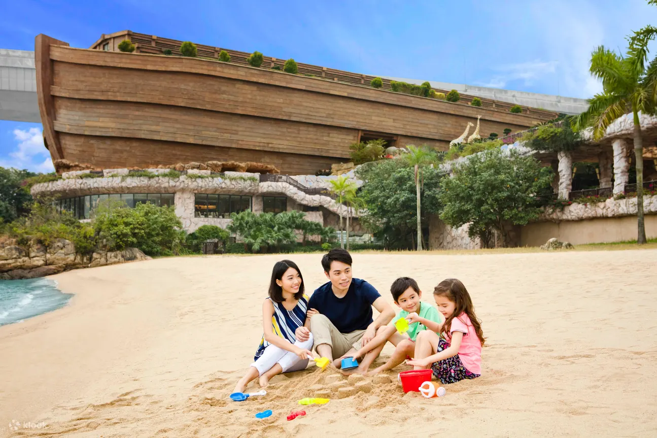 a family on beach area in Noah's Ark Hong Kong