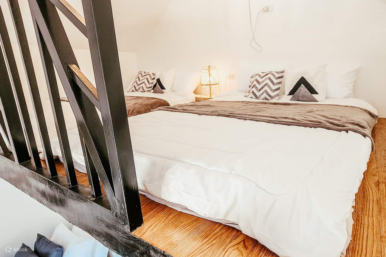 twin beds at the second floor of silong loft cabins