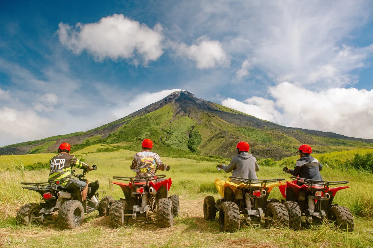 People riding ATV's with Mayon Volcano view