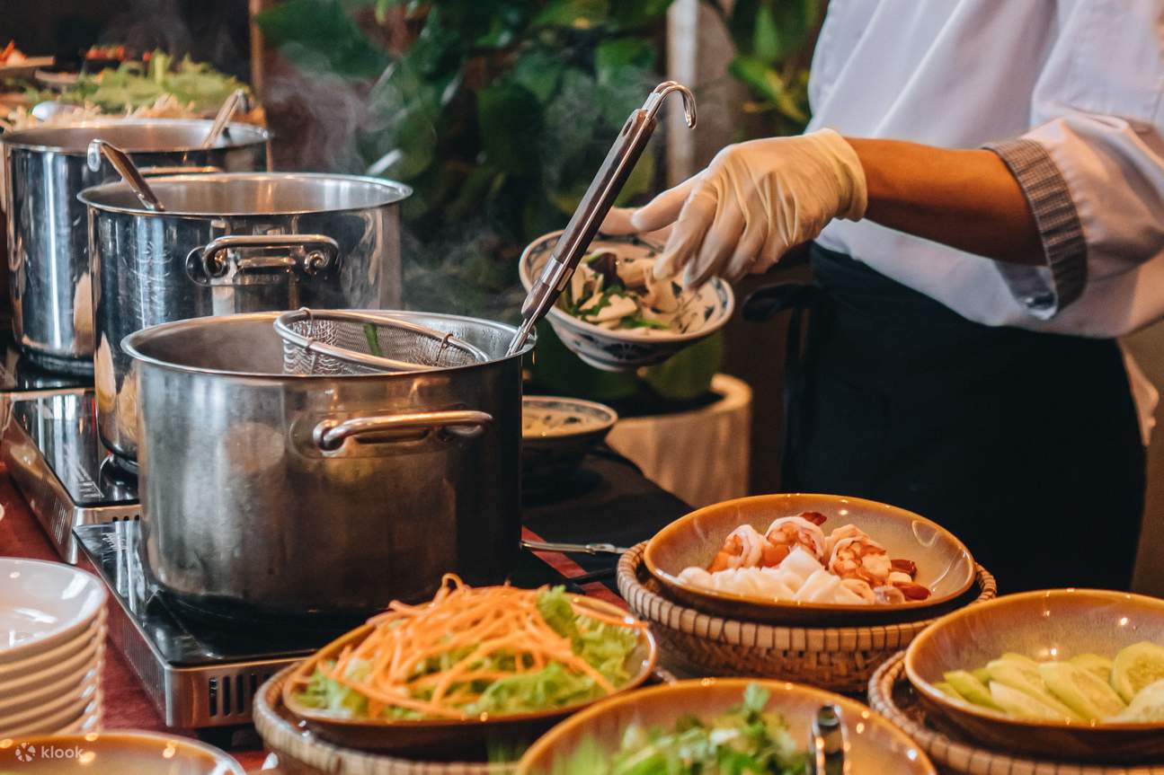 A chef skillfully preparing a variety of dishes at a buffet, showcasing their culinary expertise