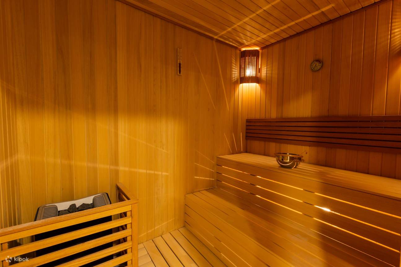 Finding tranquility in the warmth of the sauna's soothing atmosphere