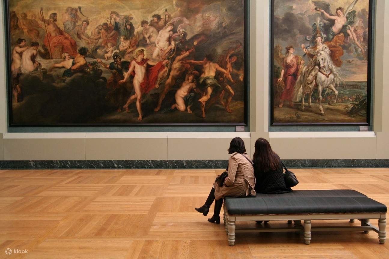 admire the artwork in louvre museum paris