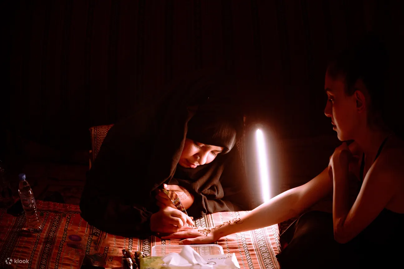 A woman doing henna in Dubai