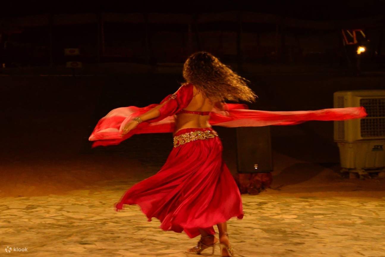 Lady in red performing a show for guests at Ras Al Khaimah 