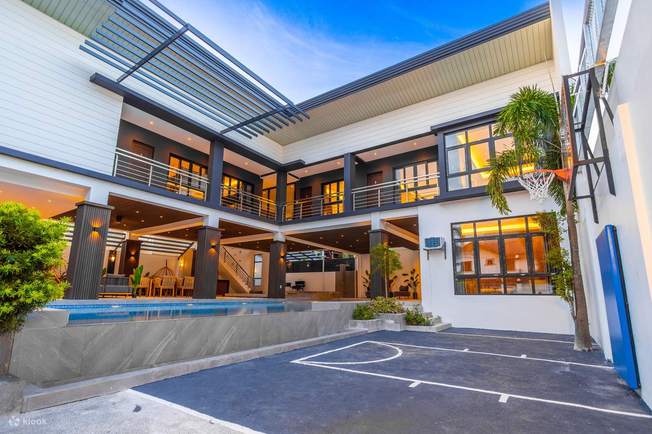 A modern home with a basketball court and pool