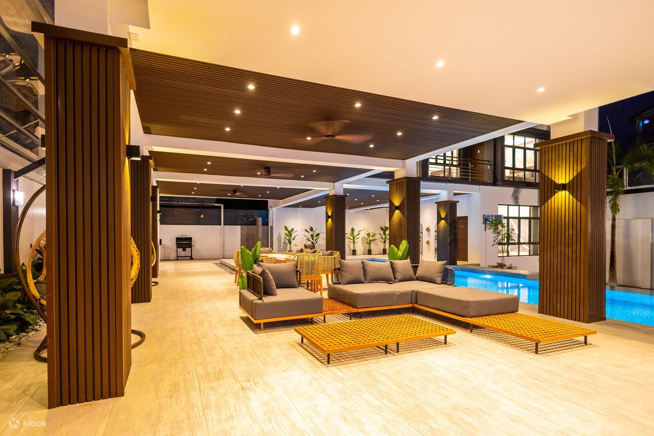 A modern living room featuring a pool and a comfortable couch