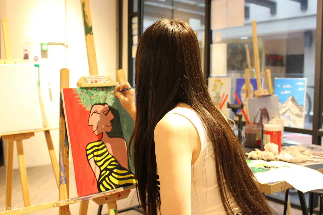 A lady is painting