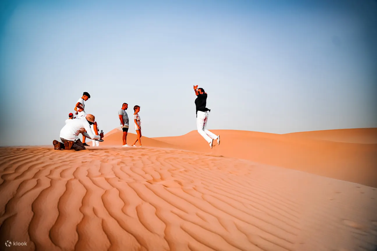 People hanging out in the desert dunes