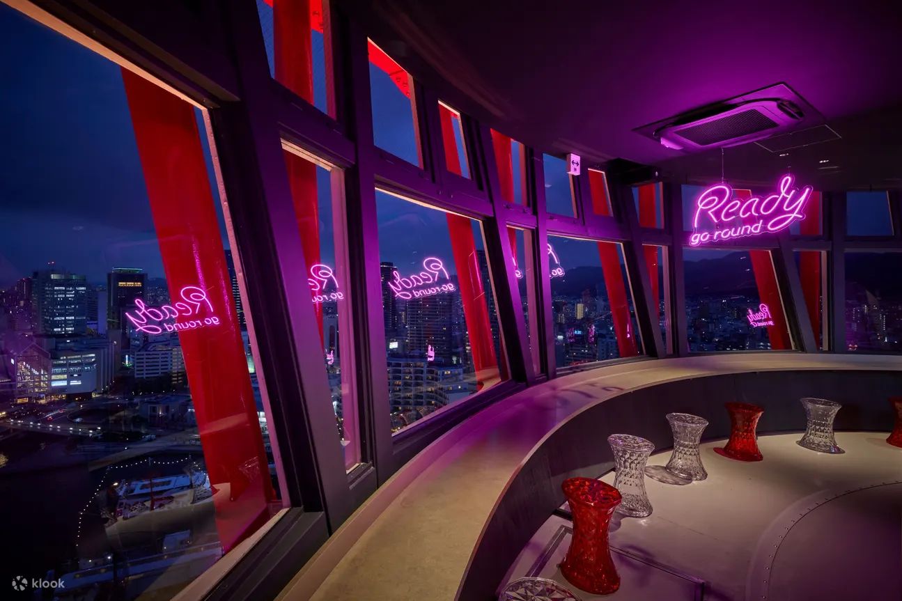 Explore a light-themed museum and relax at the café and bar featuring a 360-degree rotating floor, offering breathtaking city views