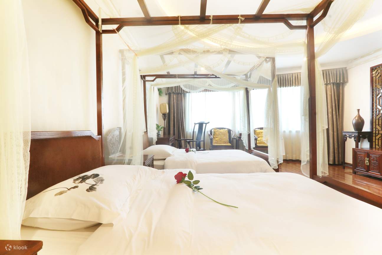 Numero totale di camere: 20 - Tipologia di letto: letto matrimoniale 1,8 metri, letto matrimoniale standard 1,2 metri * 2 - Configurazione standard a quattro stelle, stile tradizionale cinese, dotata di mobili in mogano di fascia alta, lusso di fascia alt