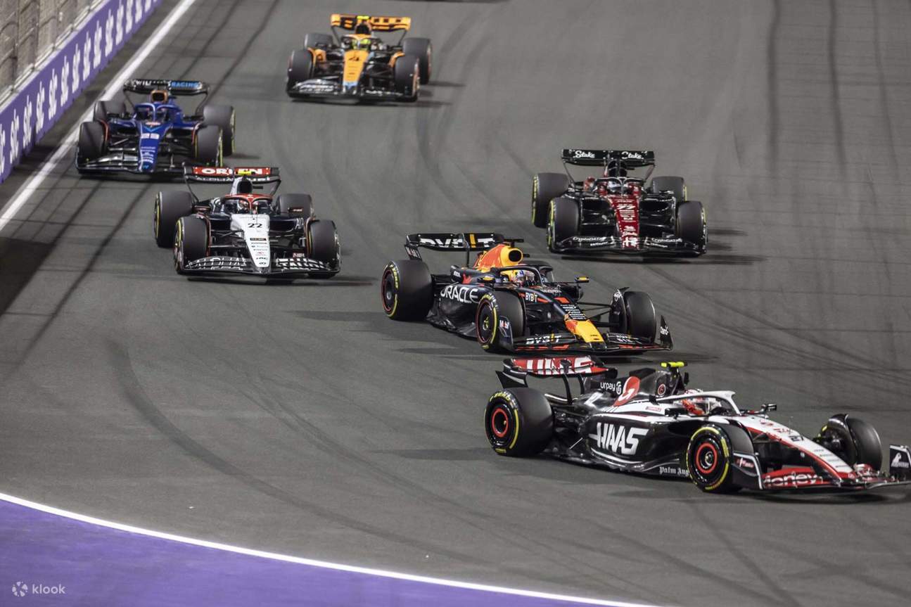 The exhilarating start of the race, with cars battling wheel-to-wheel into the first corner