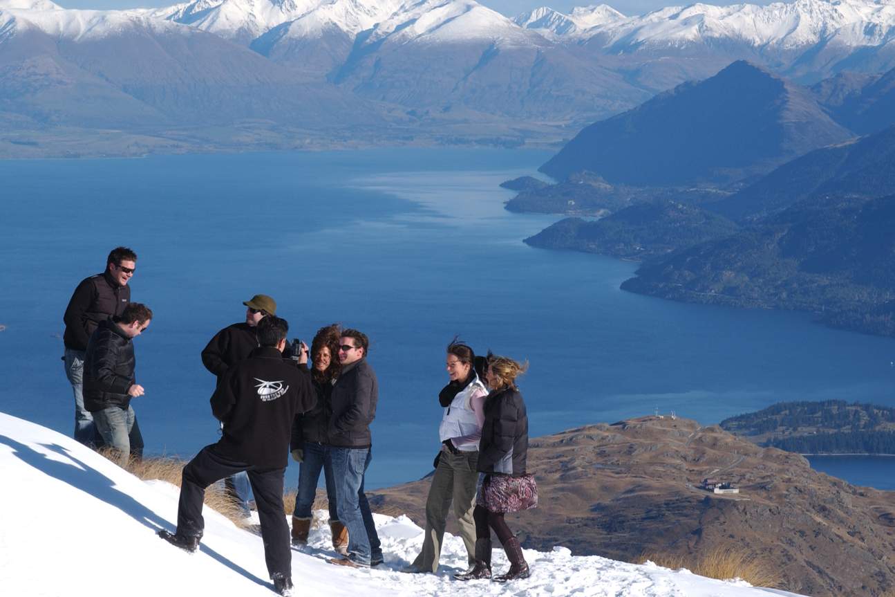 Participants taking photos after an alpine landing 