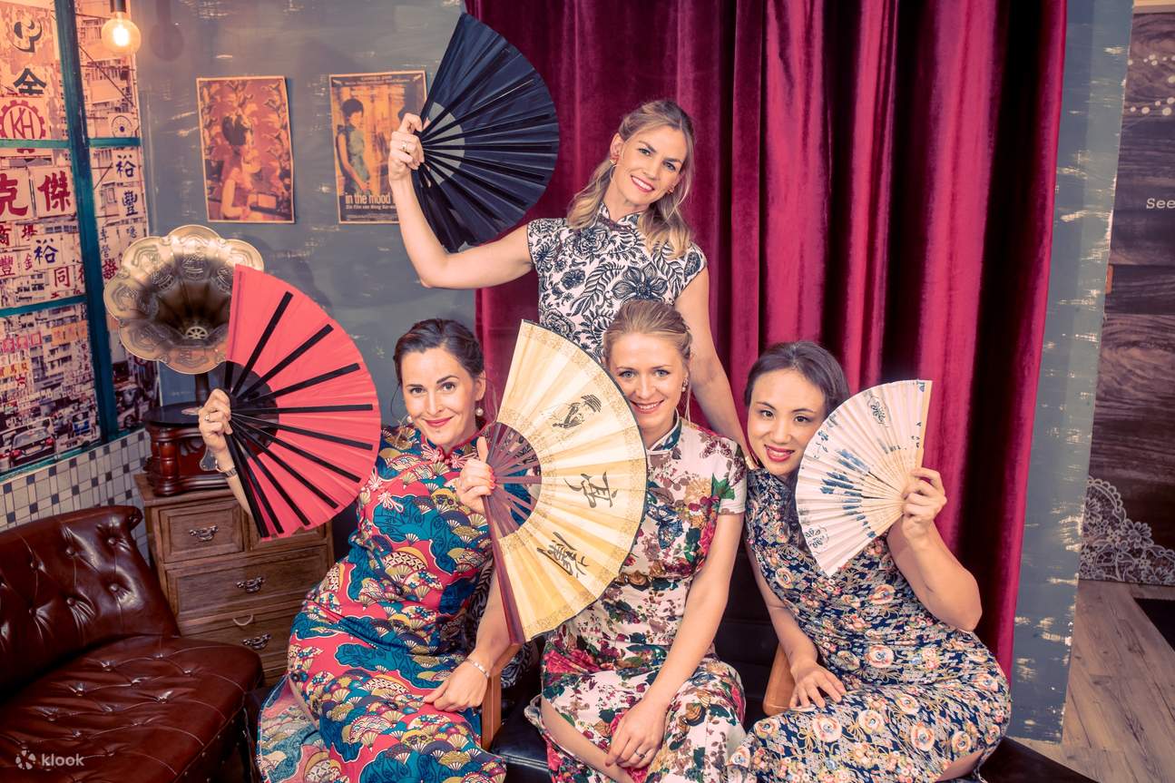 girls with fans wearing qipao