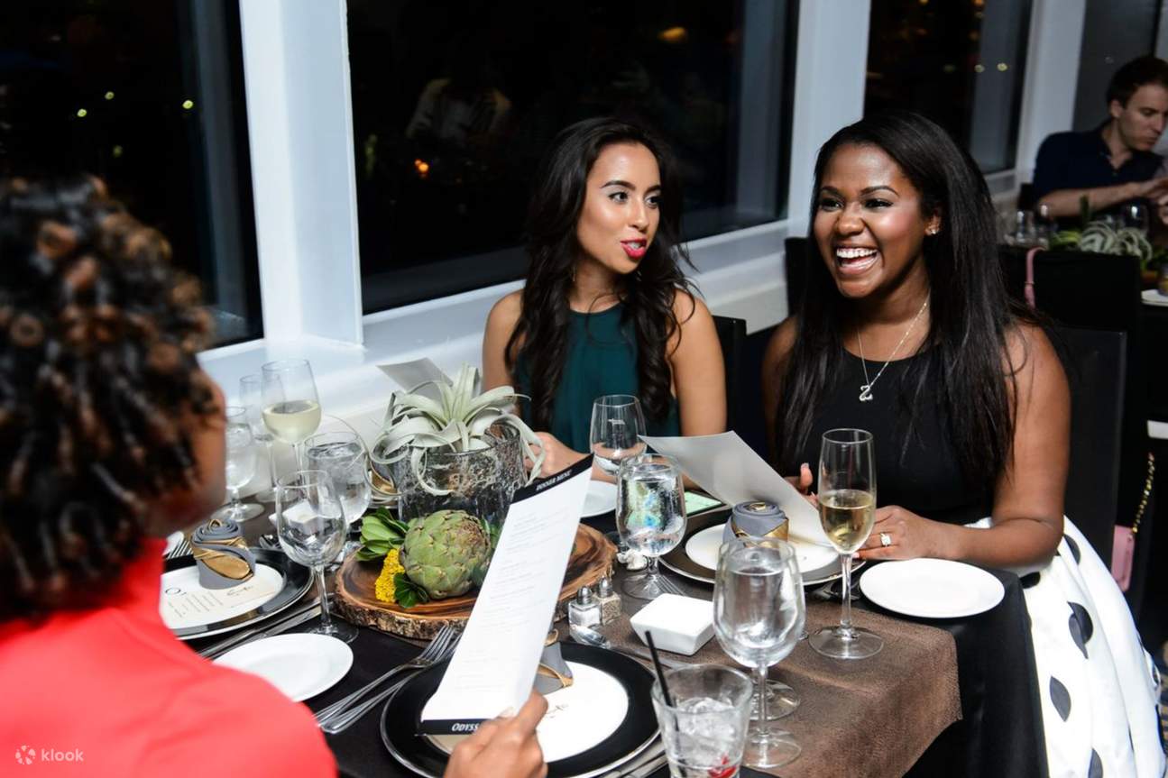 Engage in lively conversation and laughter while enjoying a delicious dinner together on the cruise